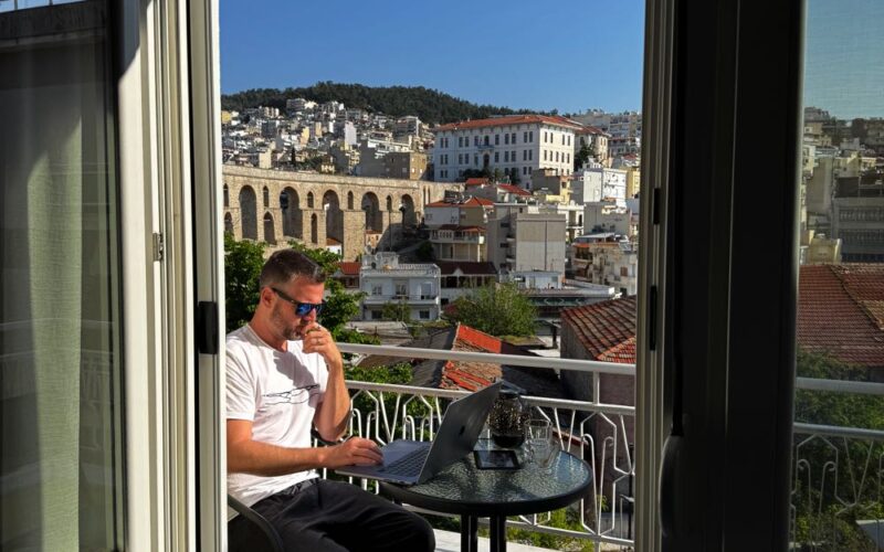 working from laptop in greece